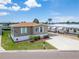 Charming single-story home with a well-manicured lawn and lovely landscaping at 108 W Saint Annes Cir, Apollo Beach, FL 33572