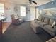 Cozy living room with carpet and comfortable seating at 108 W Saint Annes Cir, Apollo Beach, FL 33572