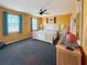 Bright and airy main bedroom with ample natural light, neutral decor, and ceiling fan at 108 W Saint Annes Cir, Apollo Beach, FL 33572
