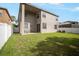 Spacious backyard featuring a well-maintained lawn, patio area, and partial fencing at 11132 Creek Haven Dr, Riverview, FL 33569
