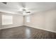 Bright bedroom with modern ceiling fan, wood flooring, and natural light from windows at 11132 Creek Haven Dr, Riverview, FL 33569