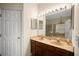 Main bathroom featuring a double sink vanity, a large mirror, and a bathtub at 11132 Creek Haven Dr, Riverview, FL 33569