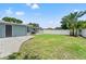 The backyard features a concrete patio, privacy fence, storage shed, and lush landscaping at 11829 104Th St, Largo, FL 33773
