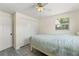 Comfortable bedroom with a closet, window, ceiling fan, and neutral walls, providing ample storage and natural light at 11829 104Th St, Largo, FL 33773