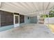 Spacious carport area offering covered parking and access to a screened-in porch at 11829 104Th St, Largo, FL 33773