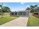 Charming single-story home with a well-maintained lawn and convenient carport, a delightful curb appeal at 11829 104Th St, Largo, FL 33773