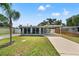 Charming single-story home with a well-maintained lawn and convenient carport, a delightful curb appeal at 11829 104Th St, Largo, FL 33773