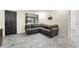 Living room showcasing the gray sectional sofa and modern plank flooring at 11829 104Th St, Largo, FL 33773