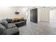 The living room features gray plank flooring and a comfortable gray sofa at 11829 104Th St, Largo, FL 33773