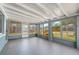 Enclosed screened lanai featuring gray painted concrete floors and light blue walls at 11829 104Th St, Largo, FL 33773