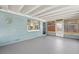 Enclosed lanai with beadboard ceiling and gray painted concrete floors, ideal for outdoor enjoyment at 11829 104Th St, Largo, FL 33773