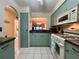 This kitchen features ample storage, modern appliances, and eat-in possibilities at 1286 Mission Hills Blvd, Clearwater, FL 33759