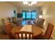 Spacious living room featuring a dining area and access to the lanai at 1286 Mission Hills Blvd, Clearwater, FL 33759
