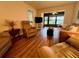 Inviting living room with wood flooring and comfortable seating arrangement at 1286 Mission Hills Blvd, Clearwater, FL 33759