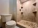 Bathroom with tiled shower, mosaic floor, and built-in shelving at 1286 Mission Hills Blvd, Clearwater, FL 33759