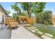 Secluded backyard featuring a pergola, fire pit, and outdoor dining area at 1313 W Carissa Ct, Tampa, FL 33604