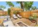 Relaxing backyard retreat with lounge chairs, a pergola, a wooden deck, and a fire pit at 1313 W Carissa Ct, Tampa, FL 33604