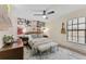 Cozy bedroom with modern decor, a guitar, and ample natural light at 1313 W Carissa Ct, Tampa, FL 33604
