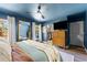Bright bedroom with large windows, a walk-in closet, and modern decor at 1313 W Carissa Ct, Tampa, FL 33604