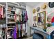 Well-organized walk-in closet with shelving, hanging space, and vanity area at 1313 W Carissa Ct, Tampa, FL 33604