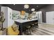 Modern kitchen boasting a large island, stainless steel appliances, and pendant lighting at 1313 W Carissa Ct, Tampa, FL 33604