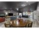 Open-concept living and dining area featuring modern furnishings and a view into the kitchen at 1313 W Carissa Ct, Tampa, FL 33604