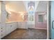 Lavish bathroom with dual sinks, white cabinets, tile floors, and lots of storage at 13310 Golf Crest Cir, Tampa, FL 33618
