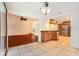 Bright kitchen featuring tile floors, stainless steel refrigerator, and wooden cabinets at 13310 Golf Crest Cir, Tampa, FL 33618