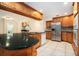 Spacious kitchen with wooden cabinets, stainless steel appliances, and tile floors at 13310 Golf Crest Cir, Tampa, FL 33618