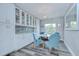Bright dining space with a modern table set, stylish decor, and open to kitchen and living areas at 14105 Farmington Blvd, Tampa, FL 33625