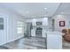 Updated kitchen with stainless steel appliances, white cabinets, granite counters, and views to the living area at 14105 Farmington Blvd, Tampa, FL 33625