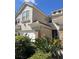 Charming two-story home featuring stone accents, a two-car garage, and lush landscaping at 14618 Mirabelle Vista Cir, Tampa, FL 33626