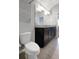 Bright bathroom features granite countertop, cabinets, and fixtures at 1613 Cabbage Key Dr, Ruskin, FL 33570
