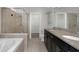 Bathroom featuring double sinks, granite countertops, shower and bathtub at 1613 Cabbage Key Dr, Ruskin, FL 33570