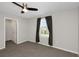 Bedroom with neutral paint and carpet with a view from a window at 1613 Cabbage Key Dr, Ruskin, FL 33570