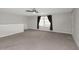 Bonus room with neutral carpet, paint, and natural light at 1613 Cabbage Key Dr, Ruskin, FL 33570