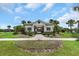 Inviting community center with manicured landscaping, offering a welcoming space for residents at 1613 Cabbage Key Dr, Ruskin, FL 33570