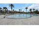 Large community pool offering ample space for swimming and sunbathing, surrounded by lush landscaping at 1613 Cabbage Key Dr, Ruskin, FL 33570