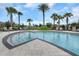 Inviting community pool with shallow end and poolside seating, perfect for relaxation and recreation at 1613 Cabbage Key Dr, Ruskin, FL 33570