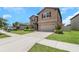 Well-kept home with a two-car garage, neat landscaping, and a welcoming walkway at 1613 Cabbage Key Dr, Ruskin, FL 33570