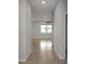 Bright hallway with tile floors leading to a living space with natural light at 1613 Cabbage Key Dr, Ruskin, FL 33570