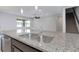 Close-up of kitchen with granite countertop and stainless steel sink at 1613 Cabbage Key Dr, Ruskin, FL 33570