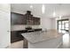 Kitchen featuring dark cabinets, granite countertops, stainless steel appliances, and eat in bar at 1613 Cabbage Key Dr, Ruskin, FL 33570