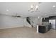 Open-concept living room with tile floors, ceiling fan, and kitchen island at 1613 Cabbage Key Dr, Ruskin, FL 33570