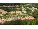Aerial view of Oakcrest community featuring lush landscaping, well-maintained homes, and community pool at 17735 Oak Bridge St, Tampa, FL 33647