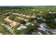Aerial view showcases community pool, lush landscaping, and beautiful homes at 17735 Oak Bridge St, Tampa, FL 33647