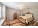 Cozy bedroom with ceiling fan, wood floors and window with view at 17735 Oak Bridge St, Tampa, FL 33647