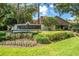 Oakcrest community entrance sign surrounded by lush landscaping and mature trees at 17735 Oak Bridge St, Tampa, FL 33647