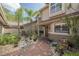 Charming courtyard entry with decorative fountain and brick-paved walkway at 17735 Oak Bridge St, Tampa, FL 33647