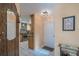 Welcoming foyer offers a glimpse into the modern kitchen with tile flooring at 17735 Oak Bridge St, Tampa, FL 33647